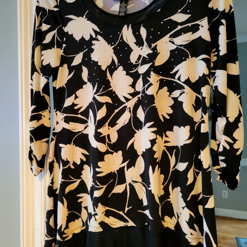 Cute top by style size small  runs a little big.